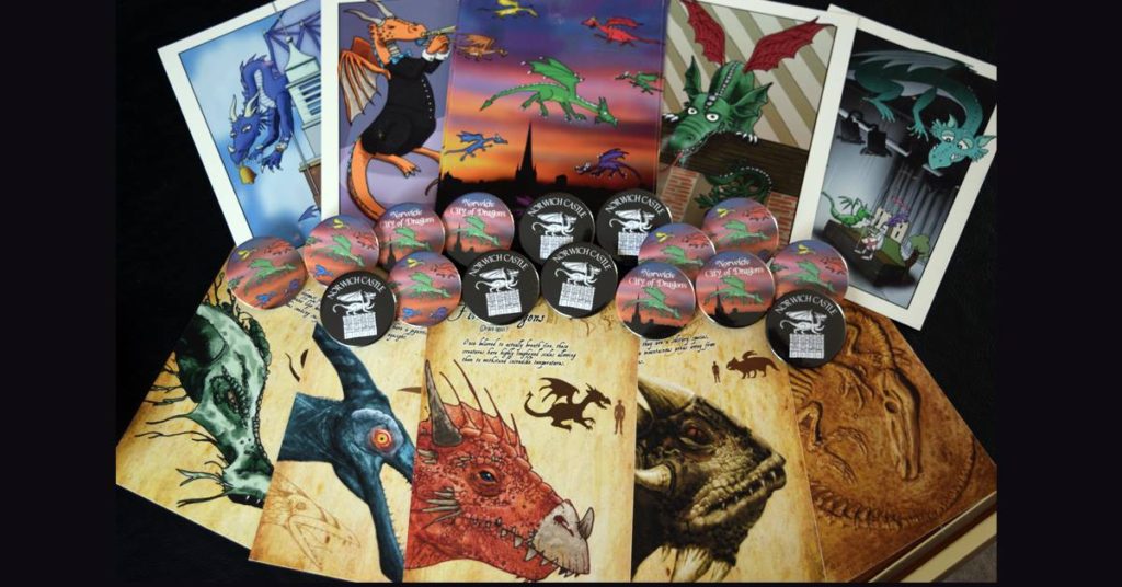 Dragon postcards and badges.